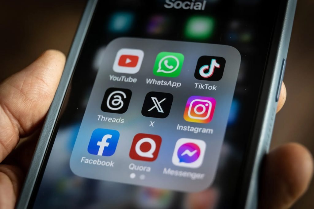 Smartphone showing a folder of social media apps